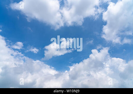 Sunshine white clouds sky during morning like in the heaven, soft focus lens flare sunlight. Abstract blurred cyan gradient of peaceful nature. Stock Photo