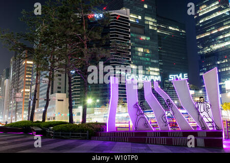 SEOUL, SOUTH KOREA - APRIL 15, 2019 : Night shot of the famous psy korean singer lighted dancing silhouettes in gangnam square. Stock Photo