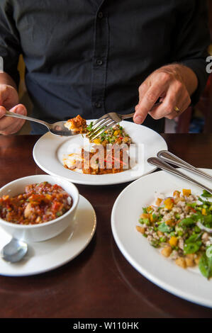 Lunch at Makphet restaurant in Vientiane, Laos. The restaurant is a social enterprise, training young at-risk people for the hospitality industry. Stock Photo