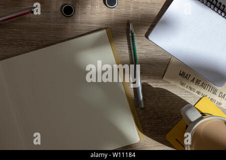 Two blank notepads and fountain pens on wooden surface Stock Photo