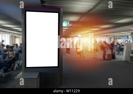 mock up of vertical blank advertising billboard or light box showcase in waiting zone at airport, copy space for your text message or media content Stock Photo