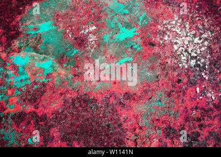 Multi-colored background, rusty metal surface with crimson and dot texture peeling and cracking Stock Photo