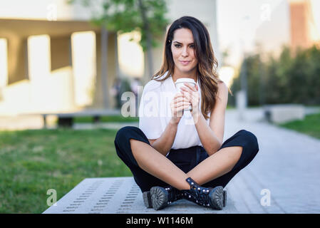 Student woman taking a coffee break at university Stock Photo