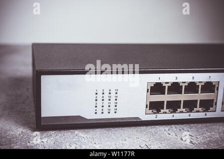 Fast Gigabit Ethernet Switch 16 Port on Dark Background Stock Photo
