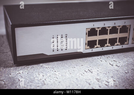 Fast Gigabit Ethernet Switch 16 Port on Dark Background Stock Photo