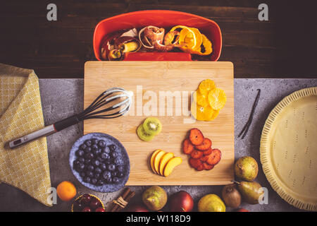 Tart Pie Prepare with Colorful Fruits and Fresh Dough on Cutting Board. Healthy Eating Food Concept. Stock Photo
