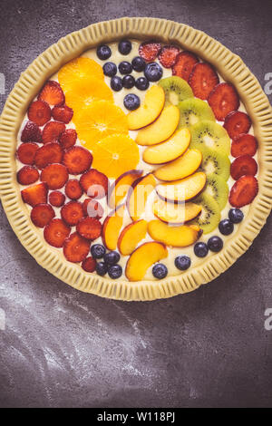 Fresh Dough Colorful Fruit Tart Pie Ready to Bake. Healthy Food Concept. Stock Photo