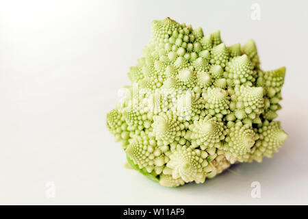 Fresh roman cauliflower, romanesco broccoli cabbage isolated on white background with copy space Stock Photo