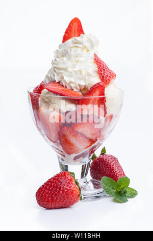A strawberry sundae topped with whipped cream. Real edible ice cream - no artificial ingredients used Stock Photo