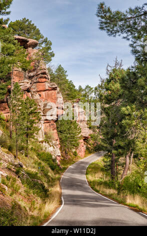 Rock formations over road near Albarracin, El Rodeno Rock Paintings area, Sierra de Albarracin, Teruel province, Aragon, Spain Stock Photo