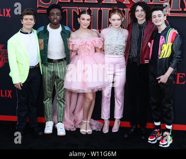 SANTA MONICA, LOS ANGELES, CALIFORNIA, USA - JUNE 28: Gaten Matarazzo, Caleb McLaughlin, Millie Bobby Brown, Sadie Sink, Finn Wolfhard and Noah Schnapp arrive at the World Premiere Of Netflix's 'Stranger Things' Season 3 held at Santa Monica High School on June 28, 2019 in Santa Monica, Los Angeles, California, United States. (Photo by Xavier Collin/Image Press Agency) Stock Photo