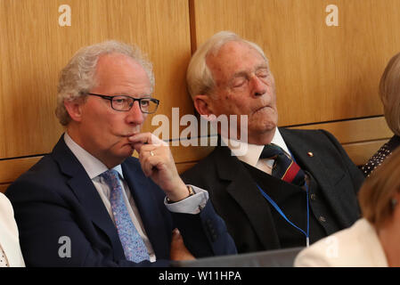 Former Scottish Labour Party politician Henry McLeish (left) and former Presiding Officer during Sir George Reid during a ceremony marking the 20th anniversary of devolution in the Holyrood chamber at the Scottish Parliament in Edinburgh. Stock Photo