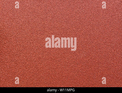 Red abrasive sandpaper seamless grunge surface, close up macro. Stock Photo