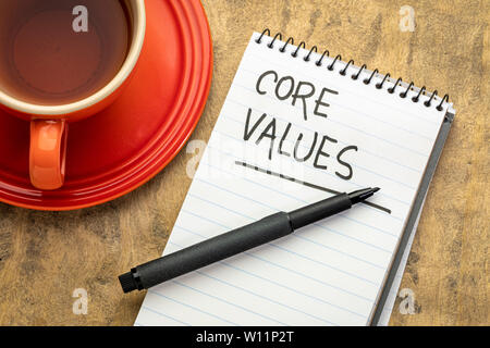 core values - handwriting in  a spiral notebook with a cup of tea Stock Photo