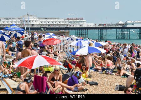 Brighton UK 29th June 2019 -  Brighton beach is packed as Britain swelters in the heatwave sunshine with some areas of the south east forecast to reach over 30 degrees  . Credit : Simon Dack / Alamy Live News