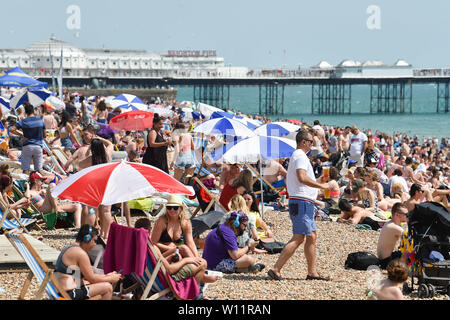 Brighton UK 29th June 2019 -  Brighton beach is packed as Britain swelters in the heatwave sunshine with some areas of the south east forecast to reach over 30 degrees  . Credit : Simon Dack / Alamy Live News