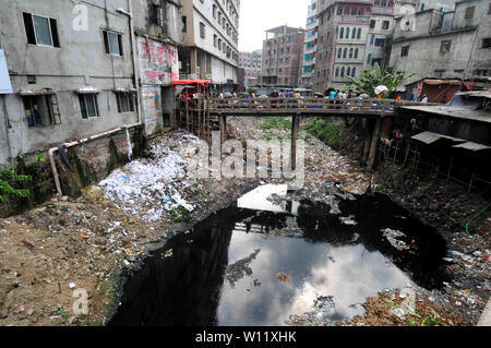 Wastage dump yard near road in Dhaka, Bangladesh Stock Photo