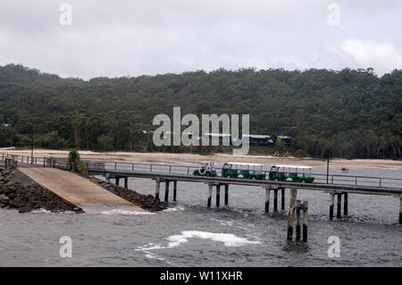 A hotel guest road train on the jetty at Kingfisher resort on Fraser Island, Queensland, Australia  Fraser Island is a World Heritage site and is the Stock Photo
