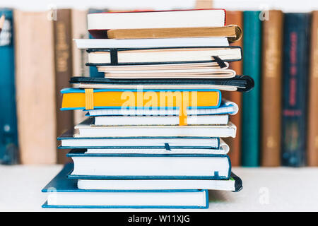 Notebooks piles, stack of books education back to school background ...