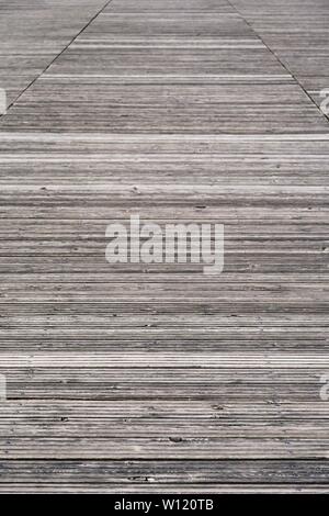 Closeup of a weathered old wooden boardwalk or footbridge - perfect background Stock Photo
