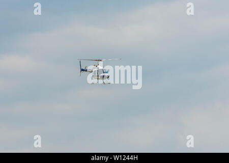 Helicopter Bell 206 during flight Stock Photo