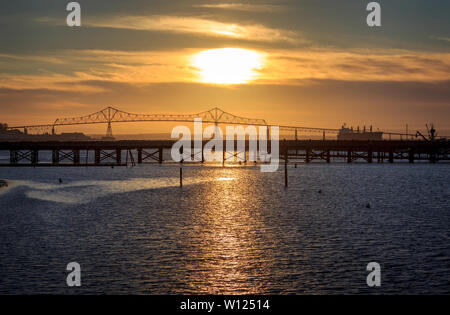 The sun starting to set in Astoria, Oregon, USA Stock Photo