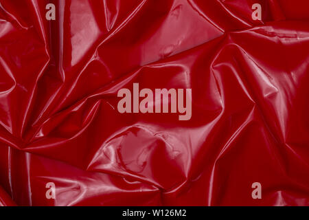 Beautiful closeup of red shiny fabric with textile texture background Stock Photo