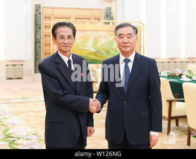 Beijing, China. 28th June, 2019. Wang Yang (R), chairman of the Chinese People's Political Consultative Conference (CPPCC) National Committee, meets with chairman of the Central Committee of the Democratic Front for National Reunification of the Democratic People's Republic of Korea (DPRK) in Beijing, capital of China, June 28, 2019. Credit: Shen Hong/Xinhua/Alamy Live News Stock Photo