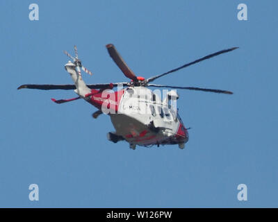 Sheerness, Kent, UK. 29th June, 2019. The coastguard helicopter (G-MCGV) seen passing low over Sheerness in Kent. Credit: James Bell/Alamy Live News Stock Photo