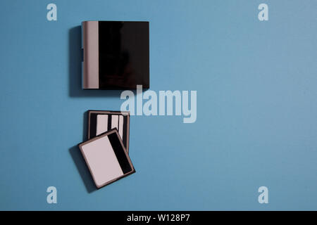 two memory cards for a camera with a digital card reader and copy space Stock Photo