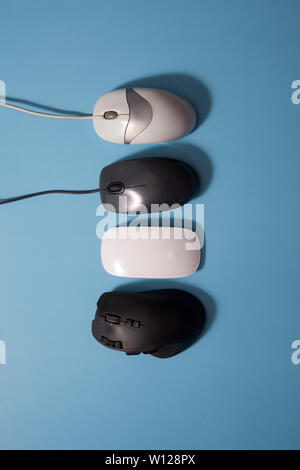 older and newer computer mouses lined up in a row Stock Photo