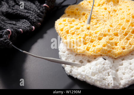 Close up knitting projects of blanket and two winter hats Stock Photo
