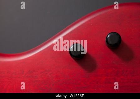 two pots on a red bass guitar with black copy space Stock Photo