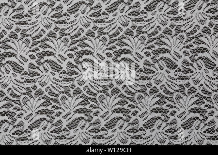 Creative black fabric with white floral pattern and textile texture background Stock Photo