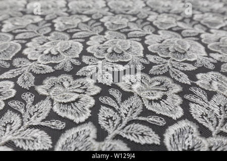 Creative black fabric with white floral pattern and textile texture background Stock Photo