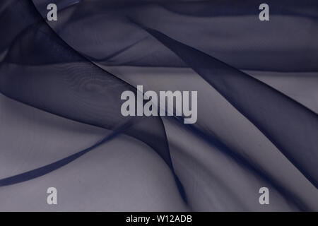 Beautiful close up of blue silk fabric with textile texture background Stock Photo