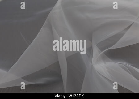 Beautiful close up of white silk fabric with textile texture background Stock Photo