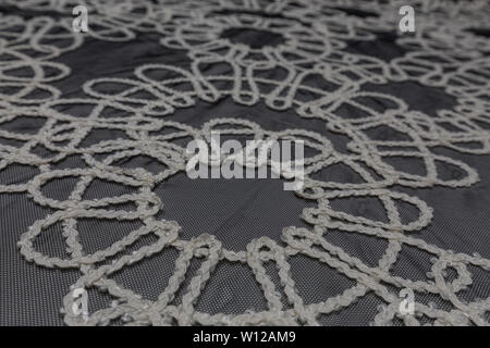 Beautiful close up of lace fabric with textile texture background Stock Photo