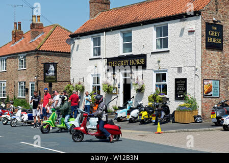 Scooter riders gathering at the Grey Horse pub in Elvington, North Yorkshire, England UK Stock Photo