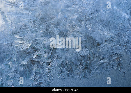 winter pattern of ice crystals on glass. Stock Photo