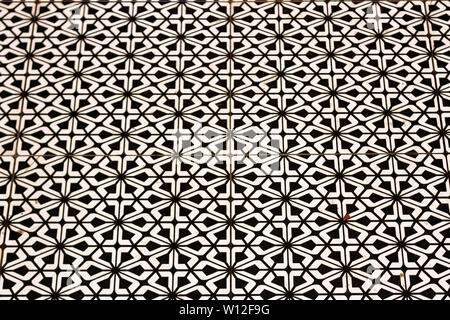 Abstract geometric pattern formed out of black and white tiles Stock Photo