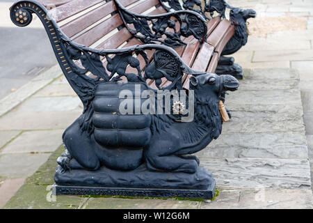 Dromedary bench in London seen from the side as detail with iron cast animals and elaborate ornate ironwork Stock Photo