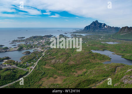 The seaside village of Kabelvag in the Lofoten Islands and the beautiful surrounding mountains and shoreline as seen from the peak of Tjeldbergtind. Stock Photo