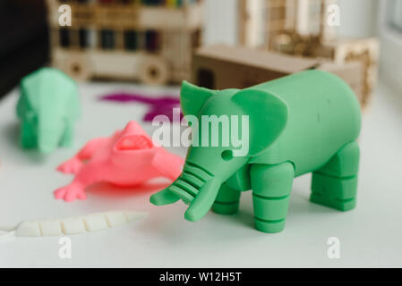 3D figures printed on an elephant, lizard, and snail printer. 3d toys for children Stock Photo