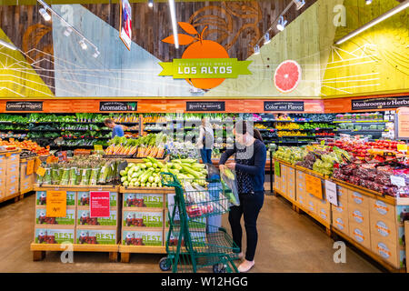 June 21, 2019 Los Altos / CA / USA - People shopping at the fruits and vegetables section at Whole Foods, which offers organic and conventional fresh Stock Photo