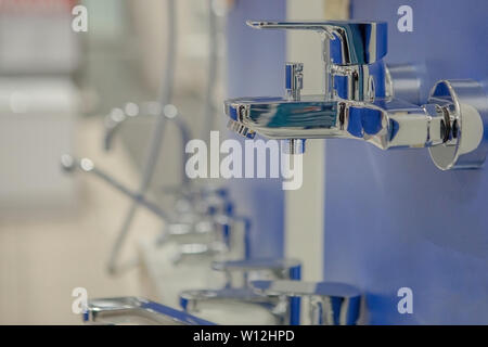 showcase in the store with faucets for the kitchen and bathroom Stock Photo