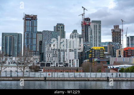London, UK - March 05, 2019: New homes and developments, modern residential buildings on river Thames in Canary Wharf Stock Photo