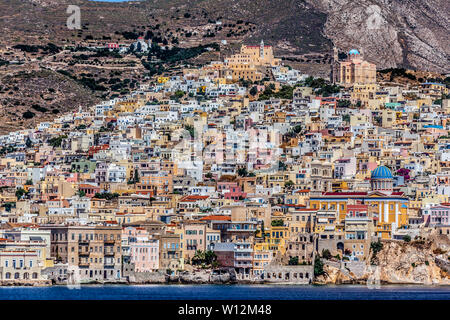 Ermoupoli town, capital of Syros island. At the back there is Ano Syra. The catholic cathedral is seen at the left hill's top, the orthodox at right. Stock Photo