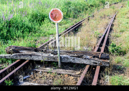 End of the line. Old railroad. The end of railroad track. Stock Photo
