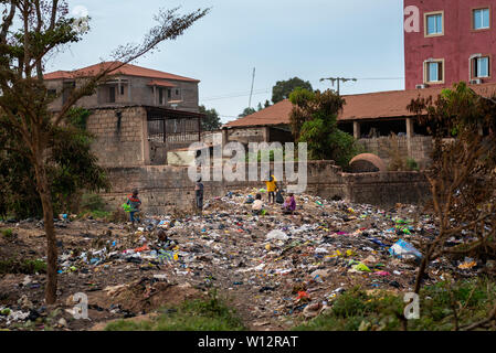 Bissau, Republic of Guinea-Bissau - February 8, 2018: Group of children collecting garbage at a landfill in the city of Bissau, in Guinea-Bissau, West Stock Photo